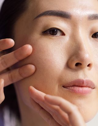 Woman doing an at-home face massage